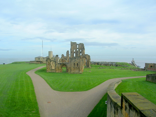 Photograph: The remains of the priory church seen from the castle gatehouse