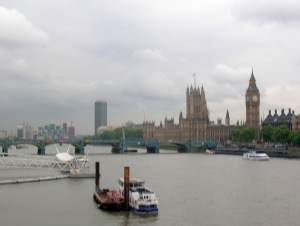 A photograph looking along the Thames at Westminster Palace on the opposite bank