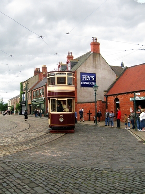 Photograph of a tram arriving in the town at Beamish