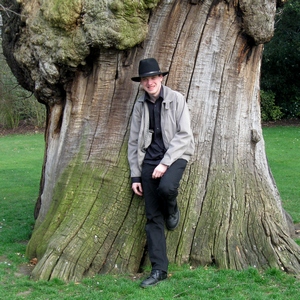 Ian Scott stood against a tree in Greenwich Park