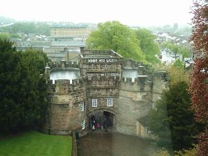 Skipton Castle: Photograph looking back down to the outer gatehouse from high in one of the inner curtain towers